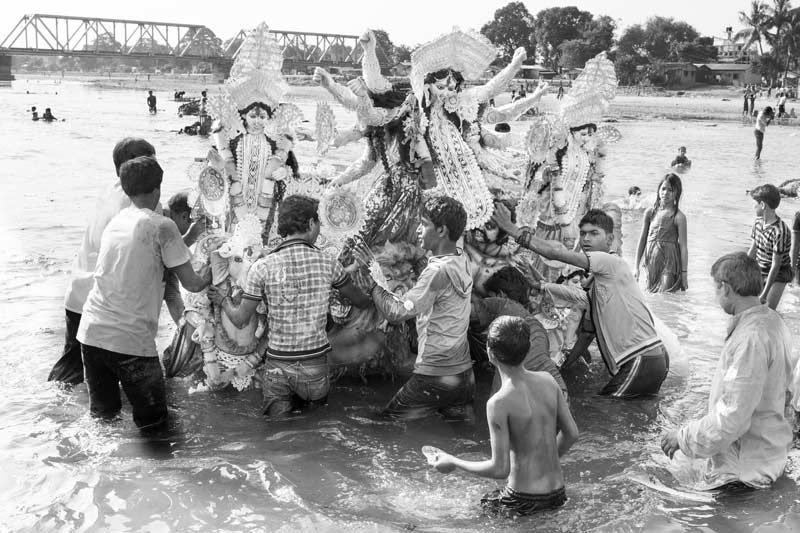 Idol immersion after Durga Puja in river Mahananda at Siliguri, district Darjeeling, West Bengal, causing river pollution